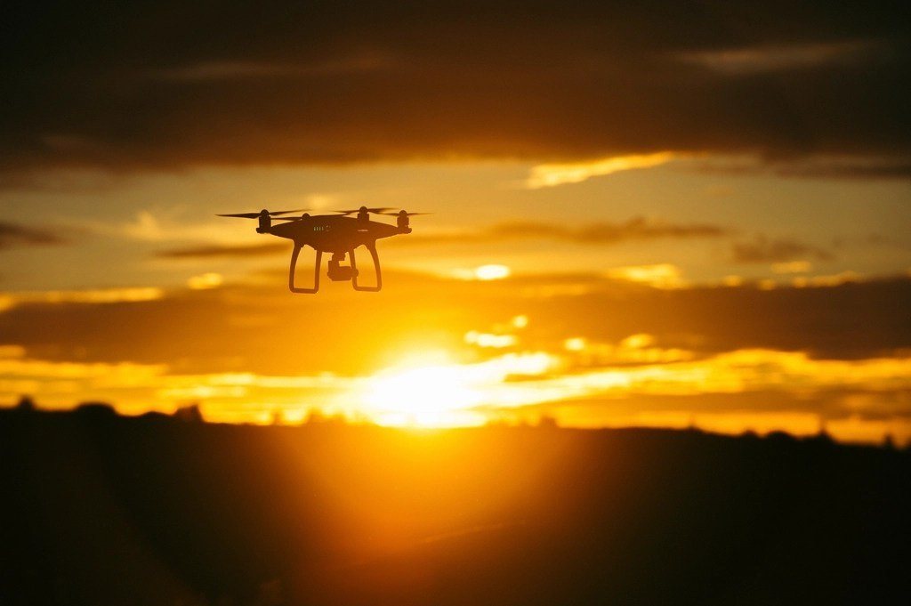 Drone flying at sunset